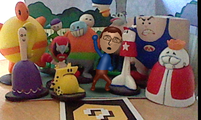 A picture of a Nintendo Mii version of Tylor Lilley celebrating in a diorama with a figures of all 12 of the main characters of Homestar Runner, taken with a Nintendo 3DS and AR card
