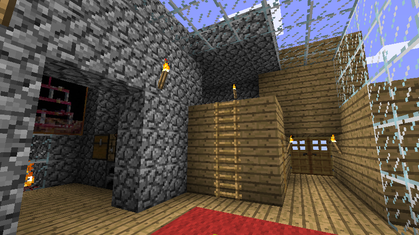 A screenshot of the entryway to a room with a fireplace and workbenches in Minecraft.