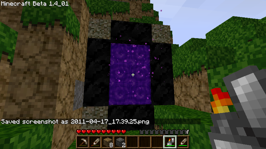A screenshot of an active nether portal in Minecraft.