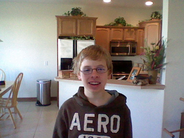 A picture of the face of Tylor Lilley at age 17 composited onto the body of Carter Lilley at age 12, taken with a Nintendo 3DS